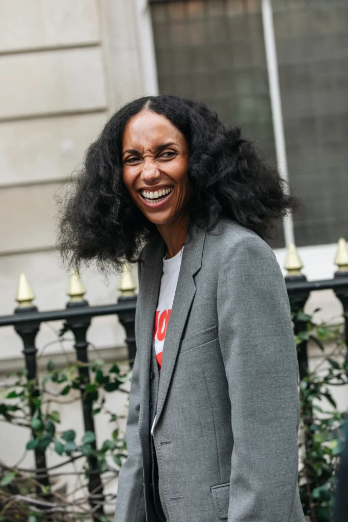 Woman in grey blazer in London street style during London Fashion Week