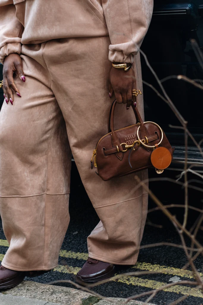 Close-up of a brown Miu Miu bowling-style bag carried at London Fashion Week in February 2025