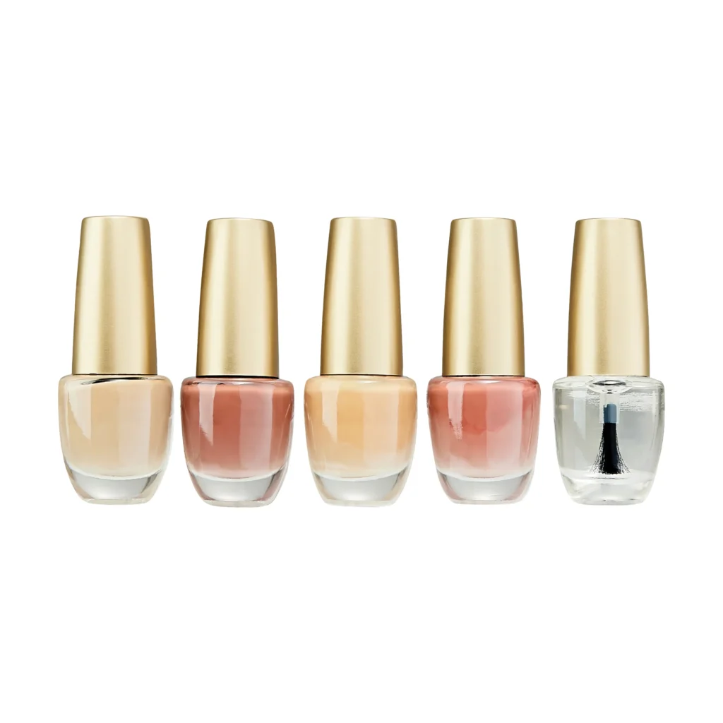 Five Glam vegan nail polishes in nude, blush and sheer shades with gold caps.